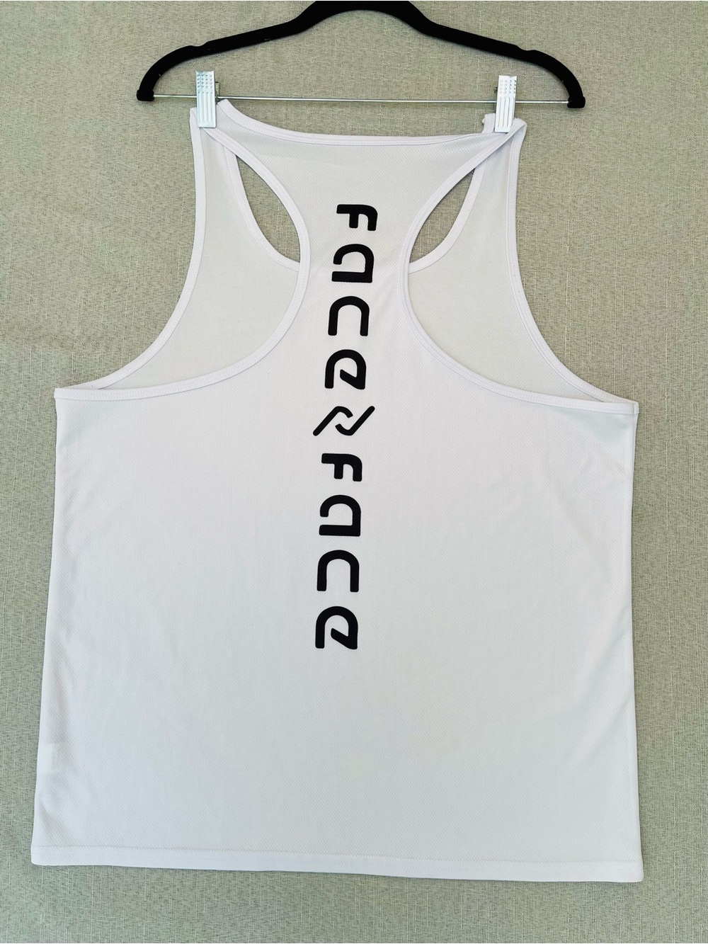 Men’s White Racerback Tank Top with Vertical Black Logo size Medium